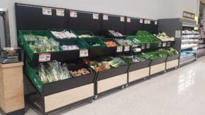 Large produce gondolas on castors with double tiered shelves to hold crates