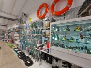 Sports store glass cabinet and hangsell wall display