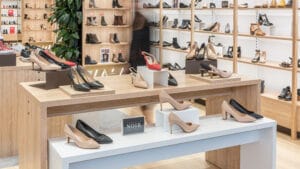 Footwear store nesting table display for shoe display