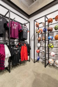 Sport store ball and apparel wall display