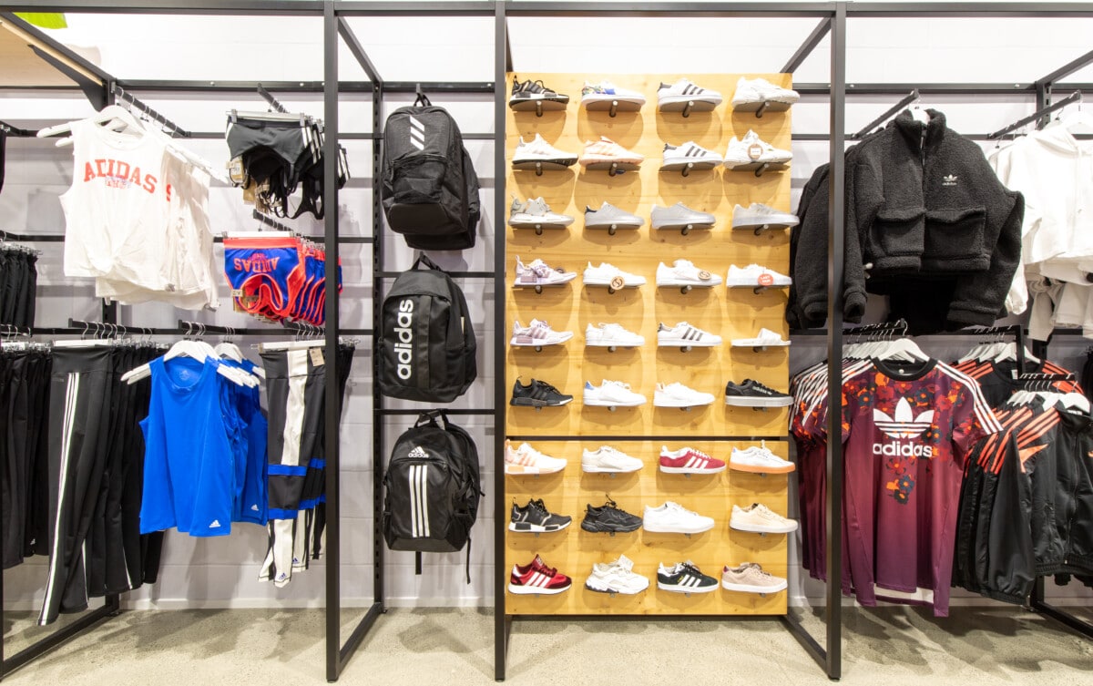 Wall system with racking for apparel and shelving for shoes