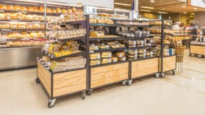 Large bakery product tables on castors with shelving and nesting table ends