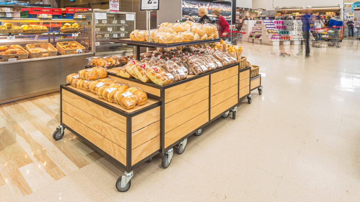 Grocery bakery tables with nesting spillover table end tables